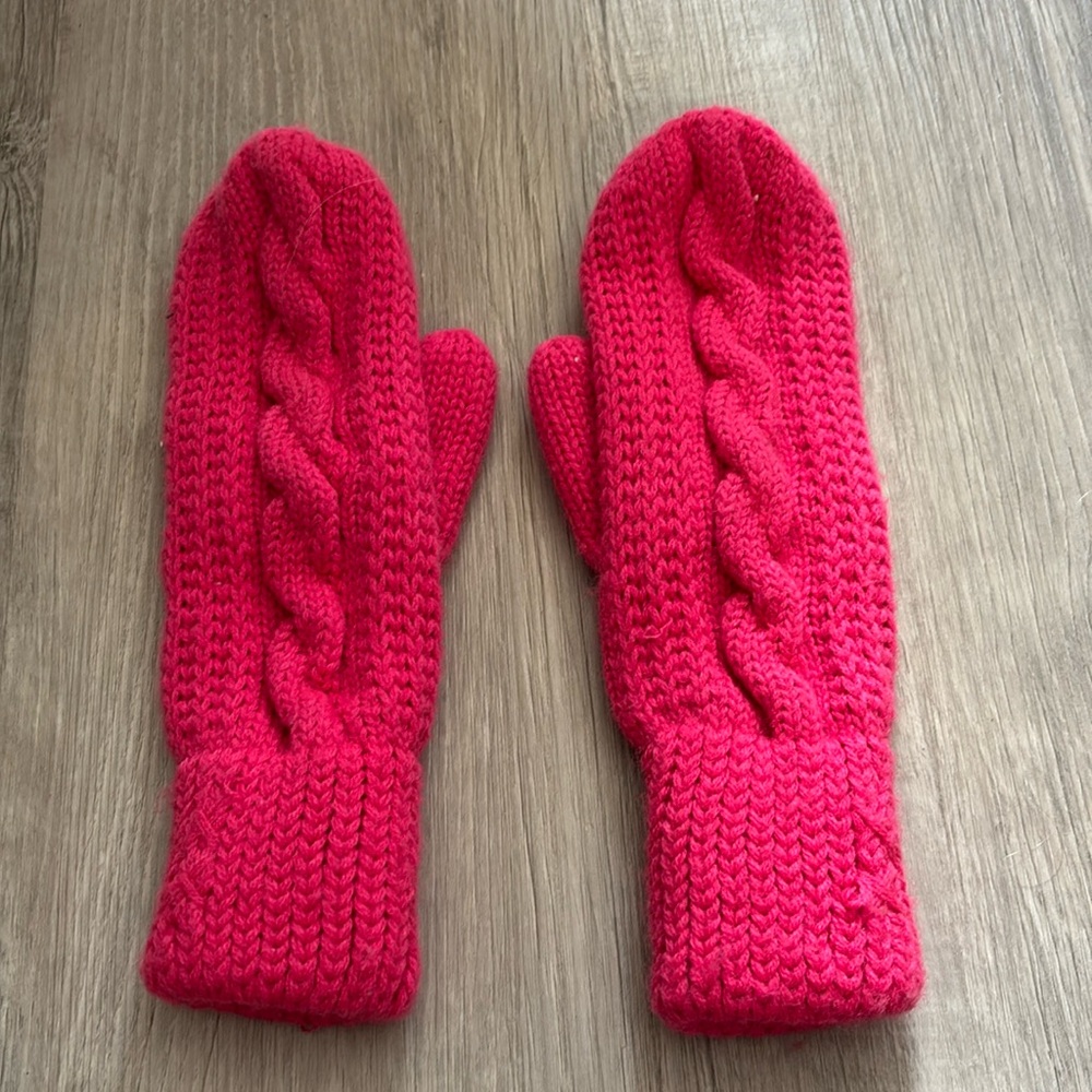Pink knitted mittens